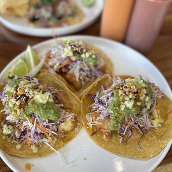 Rafelitos signature dishes Three-Pack TacosLa Lucha Libre Pounder BurritoStreet Corn